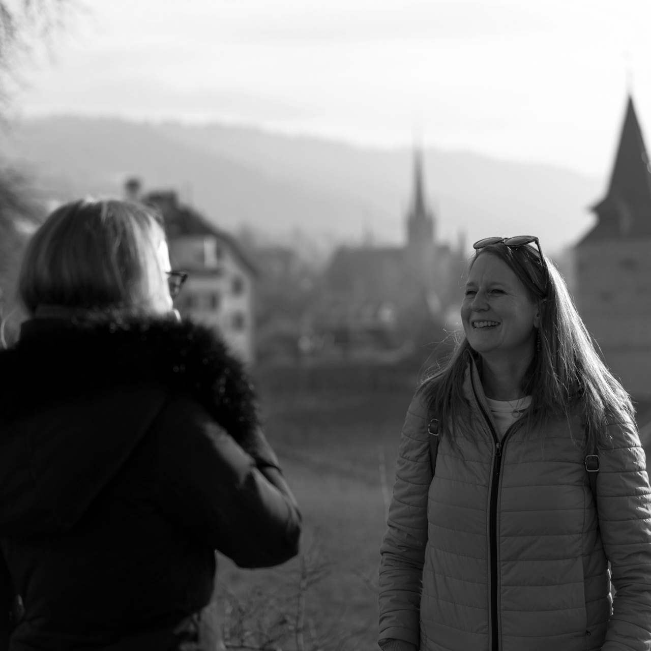 Two people talking outdoors
