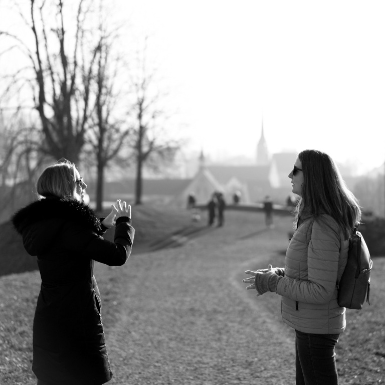 Two people walking and talking